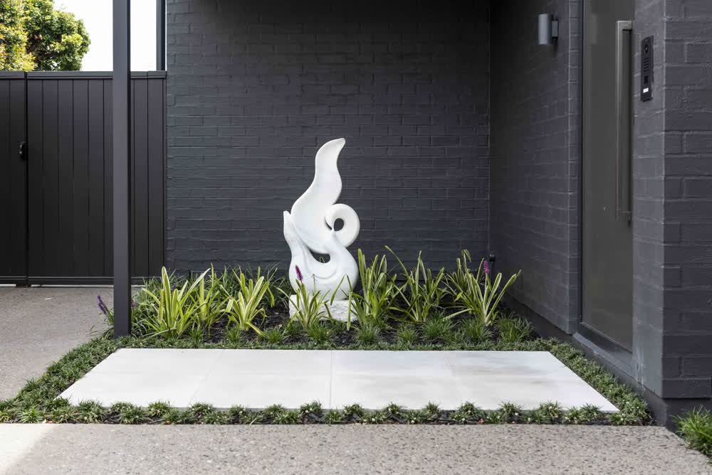 Front entrance with large white pavers